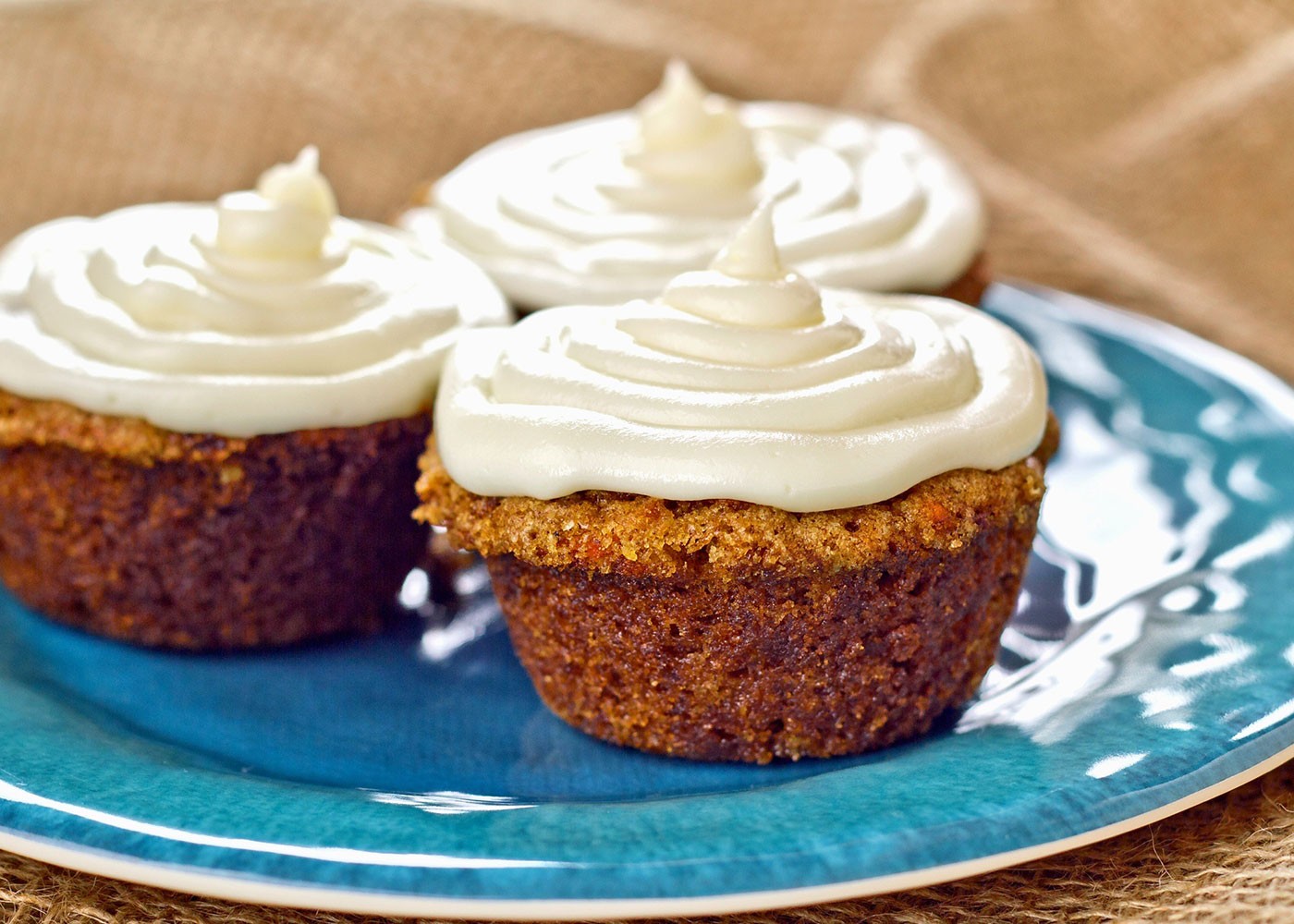 Carrot Muffins with frosting on a plate